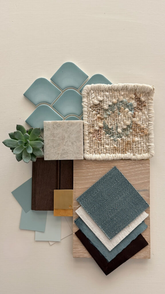 Interior design material palette featuring aqua tile, light oak, rich walnut, natural stone, layered blue fabrics, brass hardware, and a succulent.